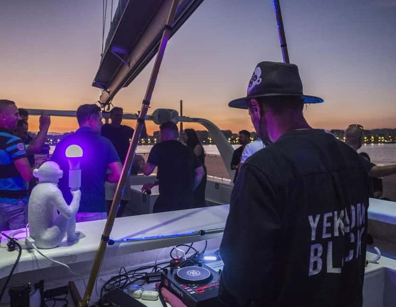 Malaga: Sailing Catamaran Sunset Cruise with Live DJ & Drink - Setting sail from Málaga Port