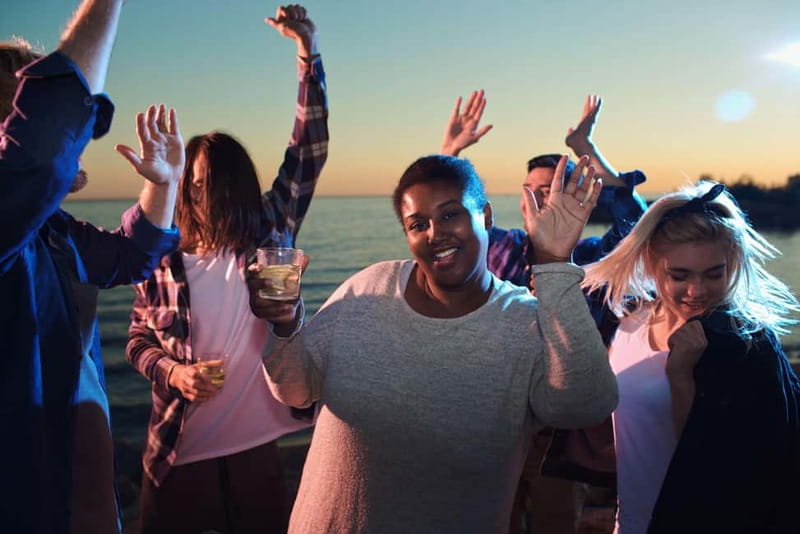 Malaga: Sailing Catamaran Sunset Cruise with Live DJ & Drink - Málaga after dark and the light show