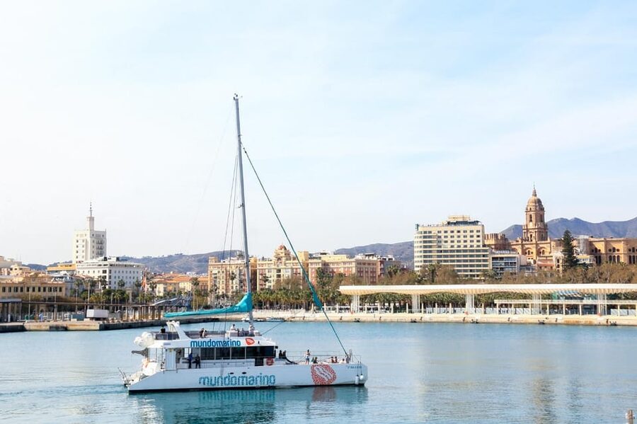 Malaga: Sailing Catamaran with Swimming and Paella Lunch - Leaving Malaga harbor for open Mediterranean views