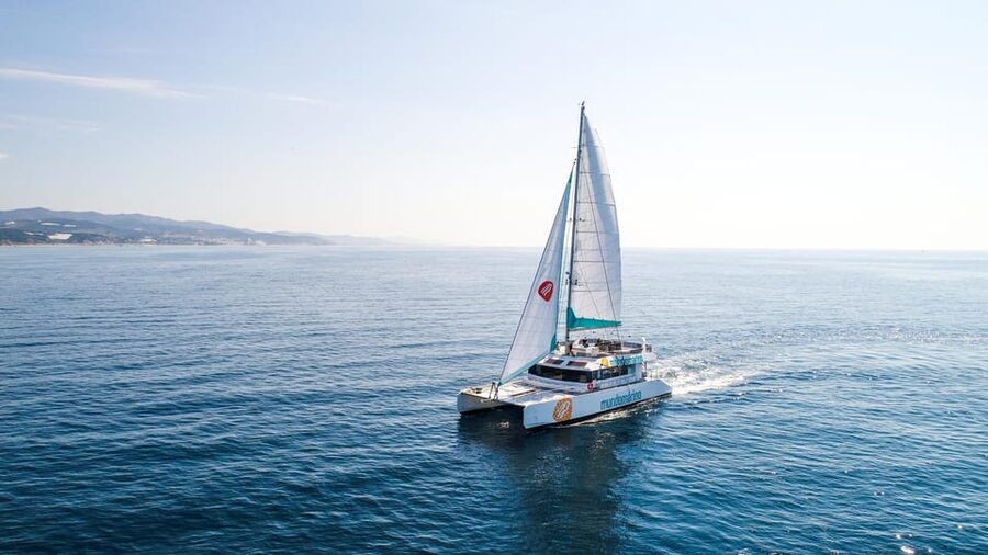 Malaga: Sailing Catamaran with Swimming and Paella Lunch - Paella lunch with salad, bread, fruit, and a drink