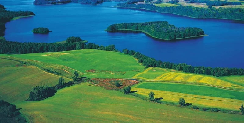 Masurian Lake District: Canoe and Sailing Tour from Warsaw - Mikołajki and Its Marina Views