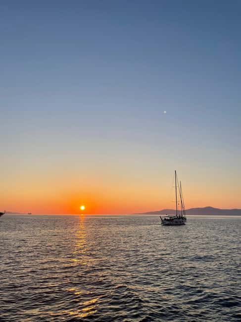 Mykonos: Sunset Sail Cruise to Rhenia, Beach Hopping, Dinner - Sunset on the return to Mykonos