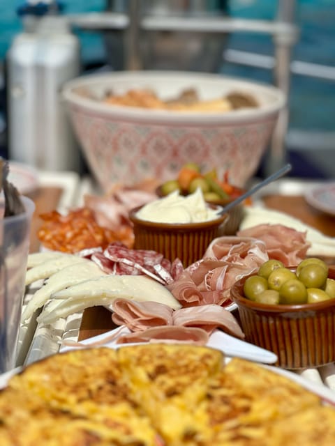 Palma de Mallorca: Sailing Boat Trip with Skipper & Tapas - The anchor stop: swimming, snorkeling, and SUP