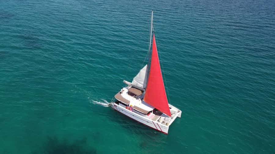 Phuket: Racha and Coral Island Sailing Day Trip by Miss.Red - Coral Island: an early swim and activity stop