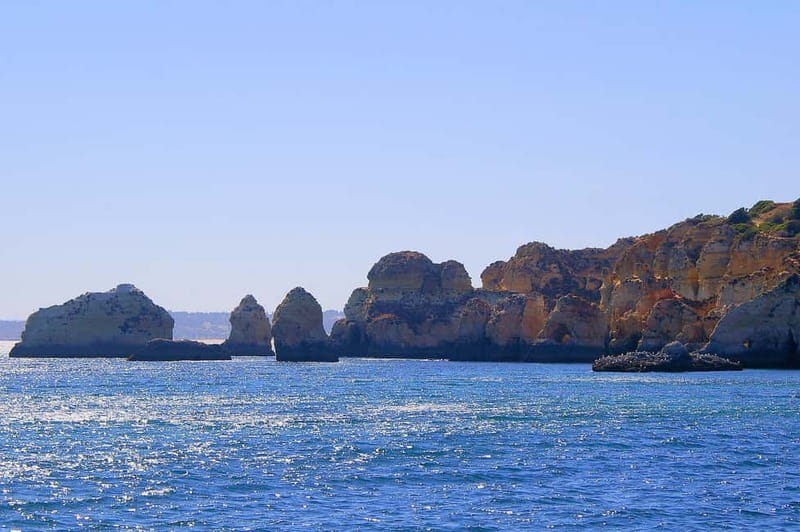 Portimão: Boat Trip by Sailing Boat to Lagos Cape Caves - Lagos harbor, castle, and old waterfront sights