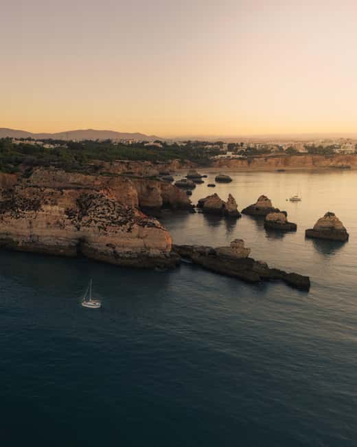 Portimão: Sunset Private Sailing Tour for Couples - The sunset near Ponta do Altar Lighthouse