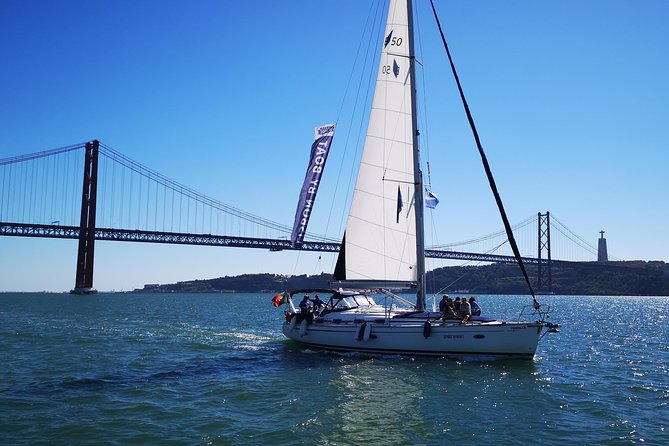 Private Lisbon Sailing Cruise on Sailing Yacht - Portuguese wine, cheese, and chouriço halfway through