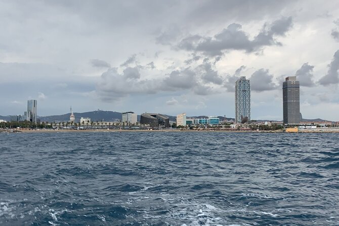 Private sailing and paddlesurfing tour with skipper up to 11 people - Port Vell, old docks and modern Barcelona