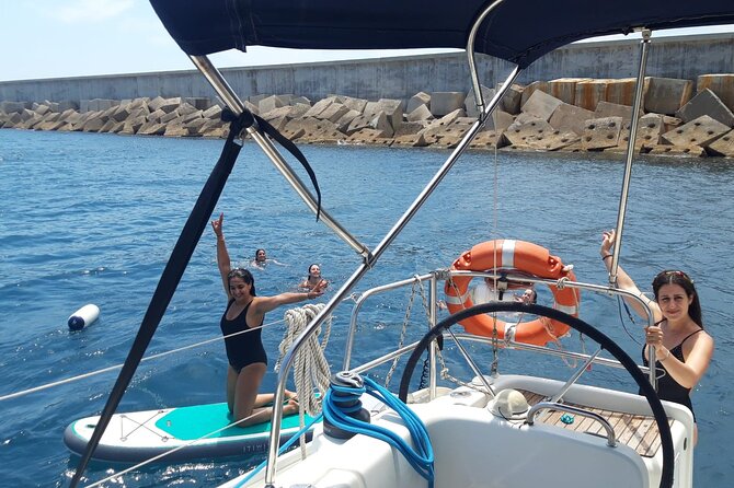 Private sailing and paddlesurfing tour with skipper up to 11 people - Bogatell Beach and the return toward the marina