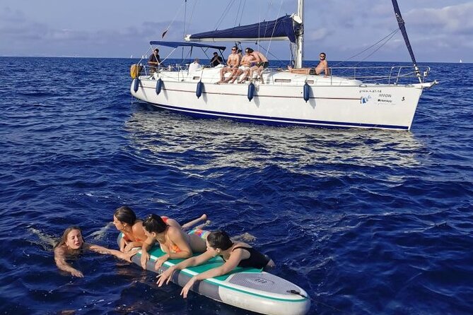 Private sailing and paddlesurfing tour with skipper up to 11 people - Barceloneta Beach from the water