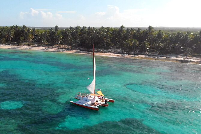 Punta Cana Private Sailing Experience - Paddleboarding between the swim stops