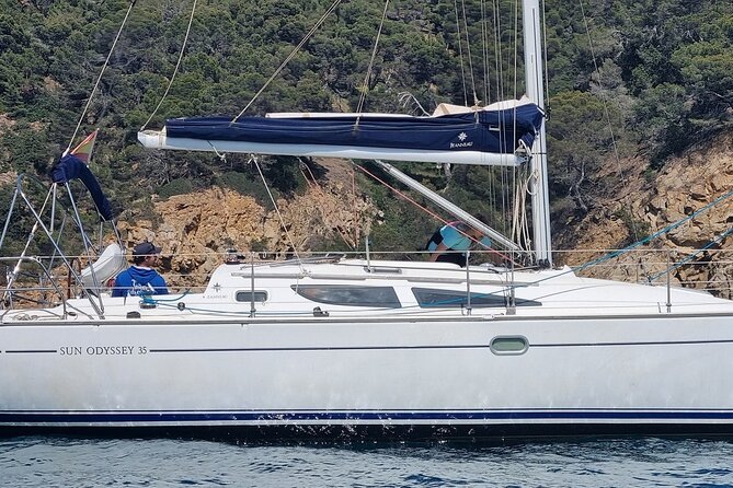 Sailing experience on a 4-hour sailboat in Girona - The cove stop: swimming, snorkeling, and paddleboarding