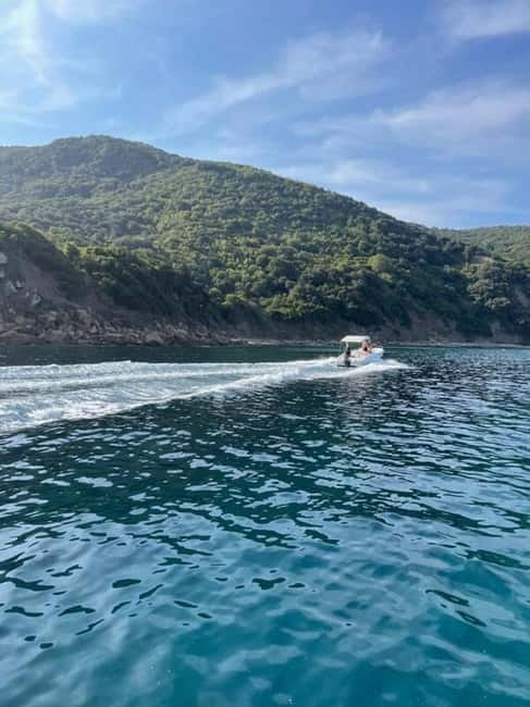 Sailing the Cilento coast: adventure, and serenity - Trentova Rock and Scoglio del Sale from the water