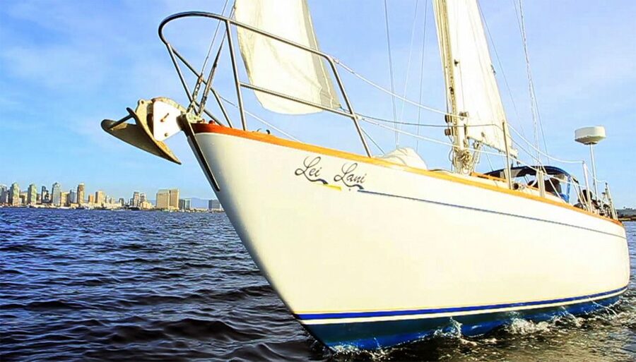 San Diego Bay: Signature 2-Hour Sailing Tour - Leaving Harbor Island Between the Sheraton Buildings