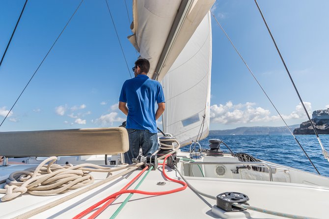 Santorini Caldera Sailing Tour with BBQ Lunch and Drinks - Red Beach and the colored southern coast