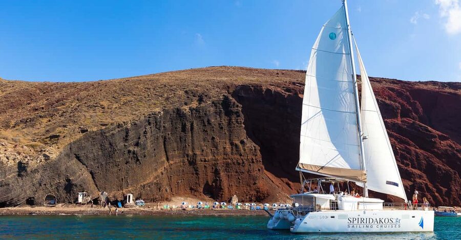 Santorini: Sailing Catamaran Cruise with BBQ and Drinks - Red Beach and White Beach from the sea