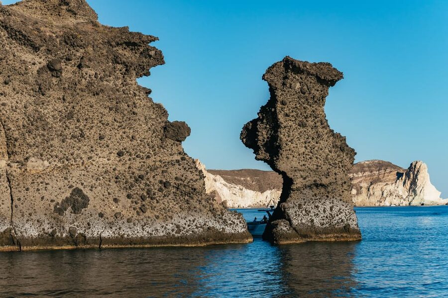 Santorini: Sailing Catamaran Cruise with BBQ and Drinks - Akrotiri Lighthouse and the approach to the caldera