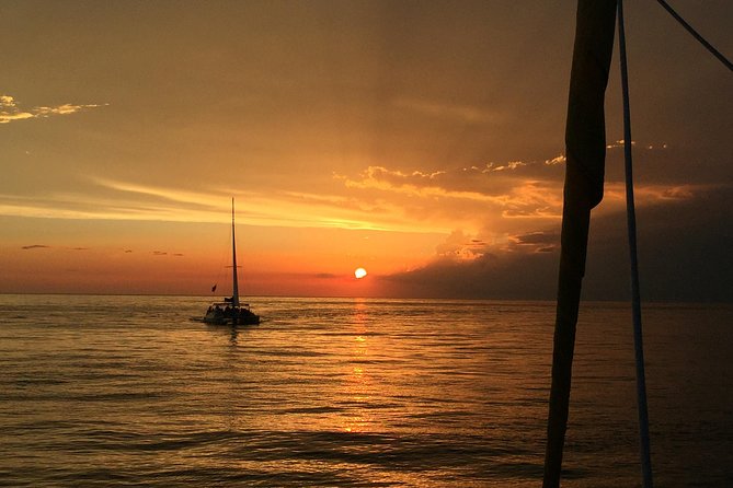 Sunset Dolphin Sail Aboard the Footloose Catamaran - Music, drinks, and the mood onboard