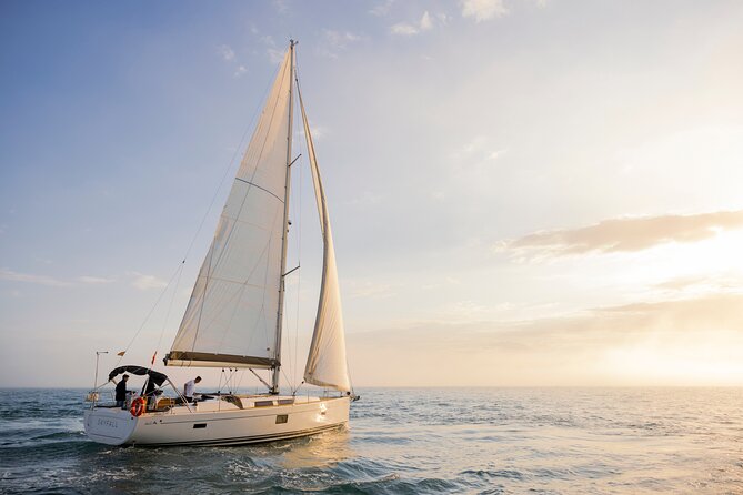 Sunset On A Luxury Sailboat From Port Olimpic - The skyline checklist from the sea
