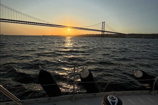 Sunset sailboat tour in Lisbon with green wine - Passing Cristo Rei and the bridge pillars