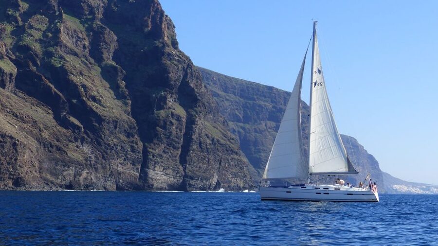 Tenerife: Los Gigantes Whale Watching Cruise by Sail Boat - Leaving Los Gigantes beneath the cliffs
