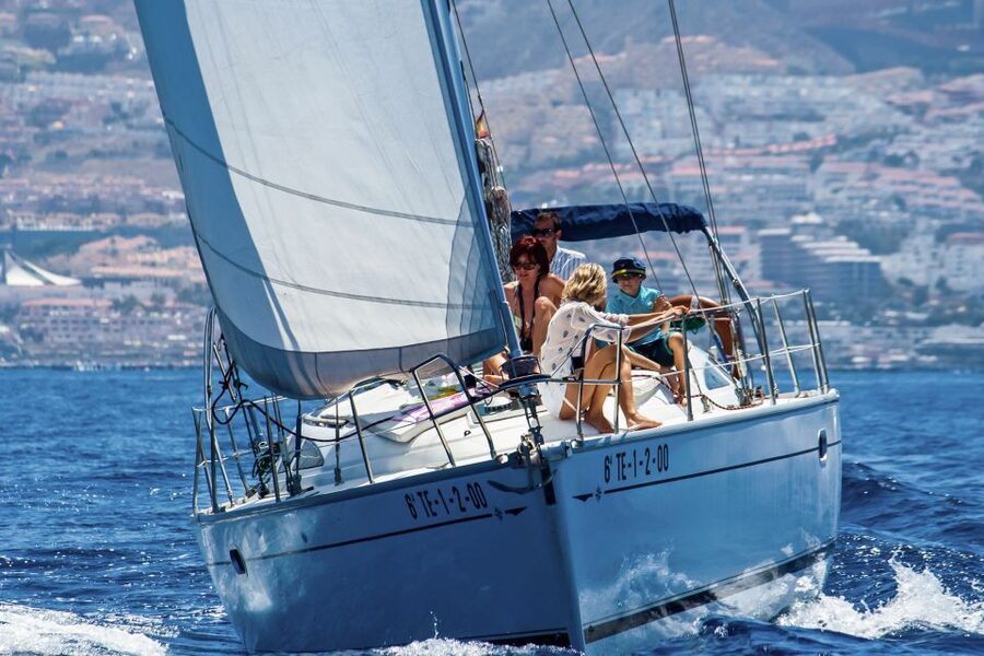 Tenerife: Sailboat Tour Whale Watching Food and Snorkeling - Sandwiches, cake, and drinks on deck